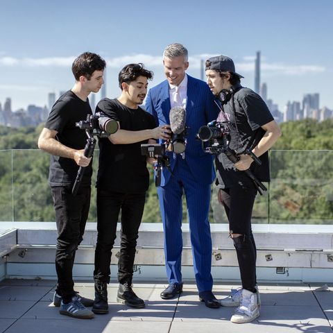 Ryan Serhant and his team inspect images and footage from a shoot at the top of 145 Central Park North.