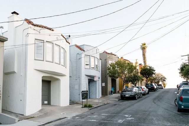 Mr. Qazi and Ms. Kumarasamy paid 18% over asking price for their house in Bernal Heights, the white home, above.