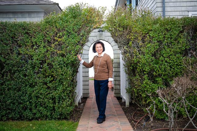 Loida Lewis outside the home in East Hampton, N.Y., that was a haven for her and her family during the pandemic .