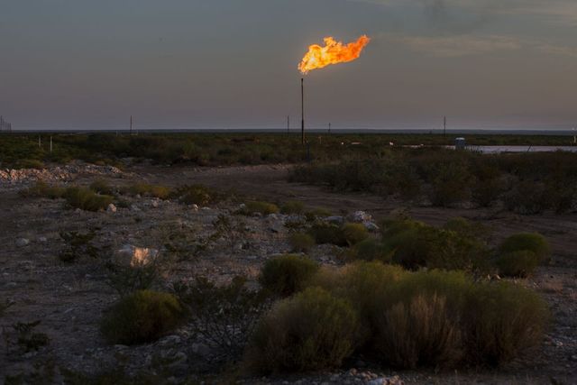 A gas flare burning in a field near Mentone, Texas