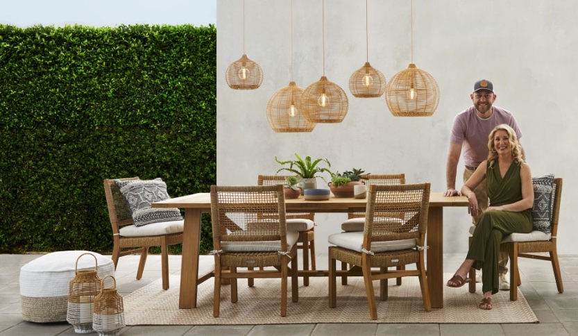 Marrs at an outdoor dining table from their collection