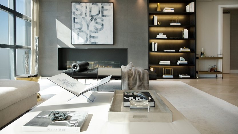 Oversized art and large coffee table books as seen in Eklund's home are a signature element of Eisen's interior design.